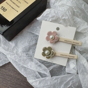 Set of two elegant floral hair clips in pink and olive green with pearl centers