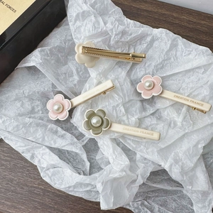 Elegant four-piece floral pearl hair clips set with French style acrylic petal design