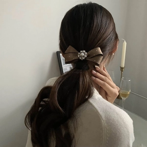 Elegant camel silk bow hair clip with pearl and rhinestone floral center detail