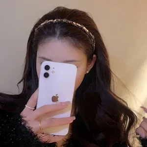 Elegant thin headband with colorful rhinestones on a metal base for high cranial top look