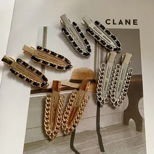 Elegant metal chain hair clips in gold and silver finish with woven leather details