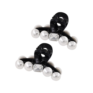 Elegant black resin hair claw clips set with white pearls and a crystal centerpiece