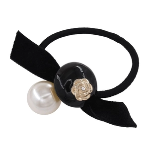 Elegant camellia pearl hair tie with black velvet bow and golden rose embossed bead