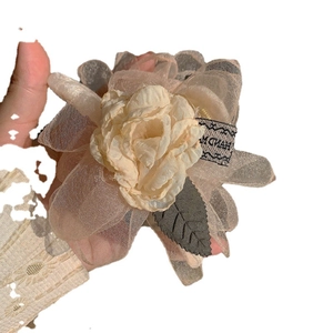 Large champagne organza flower hair claw clip with handmade label and leaf detail