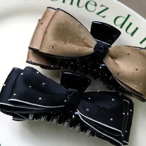 French vintage bow hair claw clips with shiny rhinestones in black and champagne gold