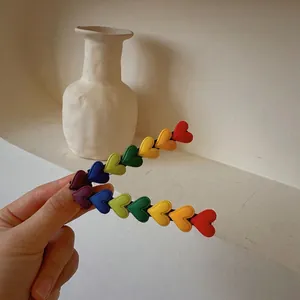 Rainbow heart long hair clips for women with colorful gradient design on black metal base