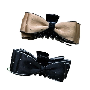 Satin bow hair claw clips with sparkling rhinestones in champagne gold and black