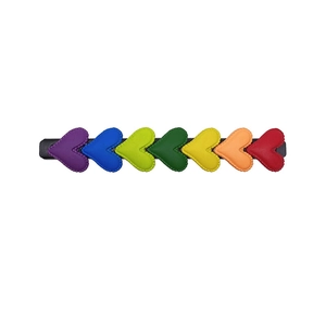 Rainbow heart hair clip with seven colorful faux leather hearts on a metal hairpin