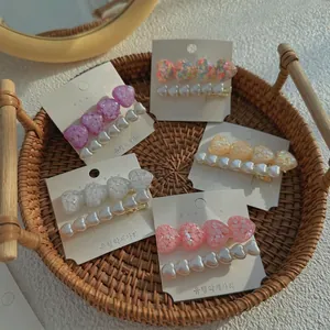 Five-piece Korean style hair clip set with glitter hearts and pearls on gold metal base