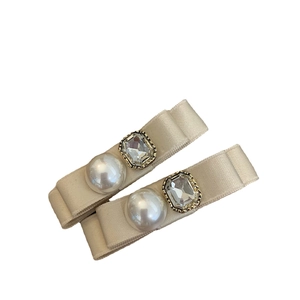 Exquisite satin ribbon hair clips set with white pearls and rhinestone embellishments