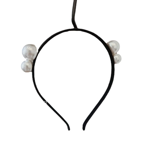 French vintage narrow headband with large white pearls on a minimalist black frame