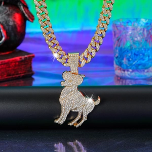 Detailed macro of gold-plated iced-out bulldog pendant on heavy Cuban link chain