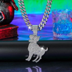 Close-up of hip hop silver iced out Cuban chain with Capricorn goat pendant and white crystals