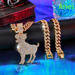 Close-up of hip-hop iced out Aries ram pendant on a gold Cuban link chain necklace