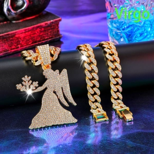 Close-up of hip hop iced out angel pendant with full rhinestone cuban link necklace