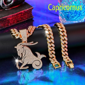 Detailed macro shot of iced-out gold Capricorn zodiac pendant on thick Cuban link chain