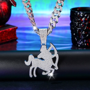 Close-up of hip-hop Sagittarius pendant necklace with iced out crystals on Cuban chain