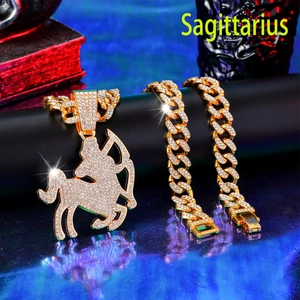 Close-up of Sagittarius iced out pendant necklace and matching gold cuban link bracelet