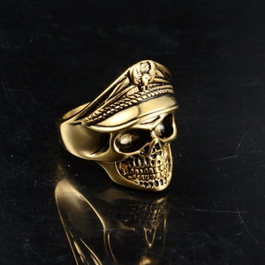Macro shot of vintage gold skull ring with military cap and eagle badge detail