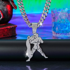 Macro shot of iced out Aquarius zodiac pendant with full pavé crystals on Cuban link chain