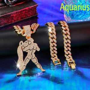 Macro view of gold plated Aquarius pendant and iced out Cuban chain set with rhinestones
