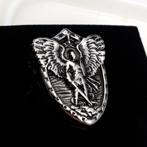 Macro shot of Archangel Michael shield ring featuring detailed high relief engraving