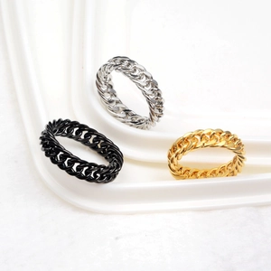 Detailed view of hip hop chain rings in polished gold, silver and black finishes