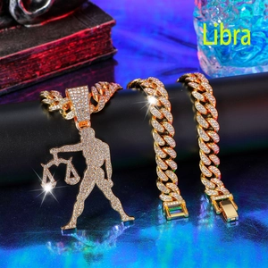 Iced out gold Libra necklace and Cuban bracelet set with shimmering white crystals