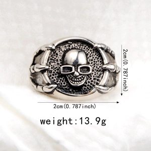 Detailed view of punk skull claw ring showing 2cm diameter and 13.9g weight dimensions