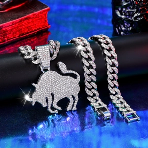 Iced out silver bull pendant necklace and bracelet set with cubic zirconia stones