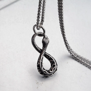 Vintage stainless steel Ouroboros infinity pendant necklace with fine scale texture