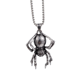 Close-up of vintage punk spider pendant in oxidized stainless steel with ball chain