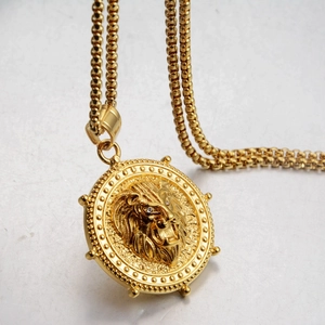 Golden lion head medallion pendant necklace with cubic zirconia eyes on beaded chain