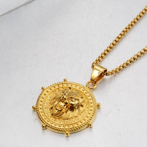 Golden box chain necklace featuring a round lion head relief pendant for men and women