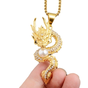 Golden Chinese zodiac dragon necklace with rhinestones and white pearl on box chain