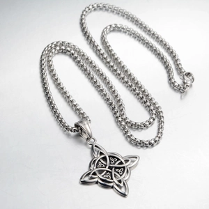 Detail view of silver Celtic knot pendant necklace with vintage oxidized steel finish