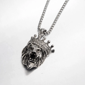 Punk style lion head pendant necklace with crown and crystals on a box chain