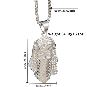 Detailed macro view of hip hop pharaoh pendant with white rhinestones on pearl chain