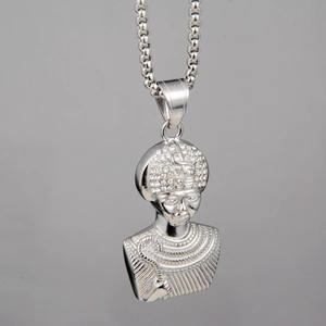 Macro shot of a silver pharaoh pendant with shimmering rhinestones on a bead chain