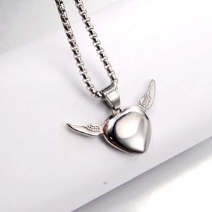 Detailed macro view of silver heart wing pendant with high-quality polished box chain