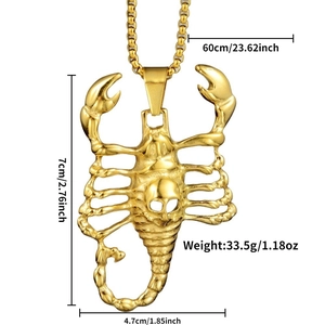 Detailed view of golden scorpion pendant with skull pattern and product dimensions