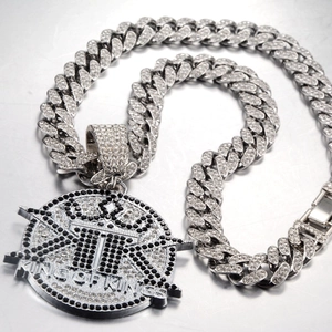 Hip hop silver cuban necklace with a large round iced out pendant featuring the letter K
