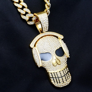 Close-up of hip hop skull pendant with headphones and sparkling white rhinestones