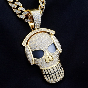 Hip hop skull with headphones pendant necklace featuring iced out rhinestones and gold plating
