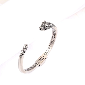 Vintage stainless steel open leopard head bracelet with retro carved floral patterns
