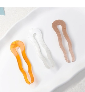 Three-piece set of U-shaped acetate hair pins in amber, pearl white, and dusty pink