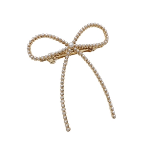 Barrette à cheveux élégante en forme de nœud doré avec perles blanches et ressort