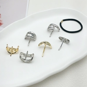 Minimalist gold and silver ponytail hook set with sleek wave and spiral metal designs