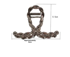 Detail shot of rose gold alloy claw clip with twisted weave design and dimensions