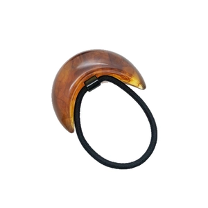 Retro U-shape amber resin ponytail holder with black elastic band on white background